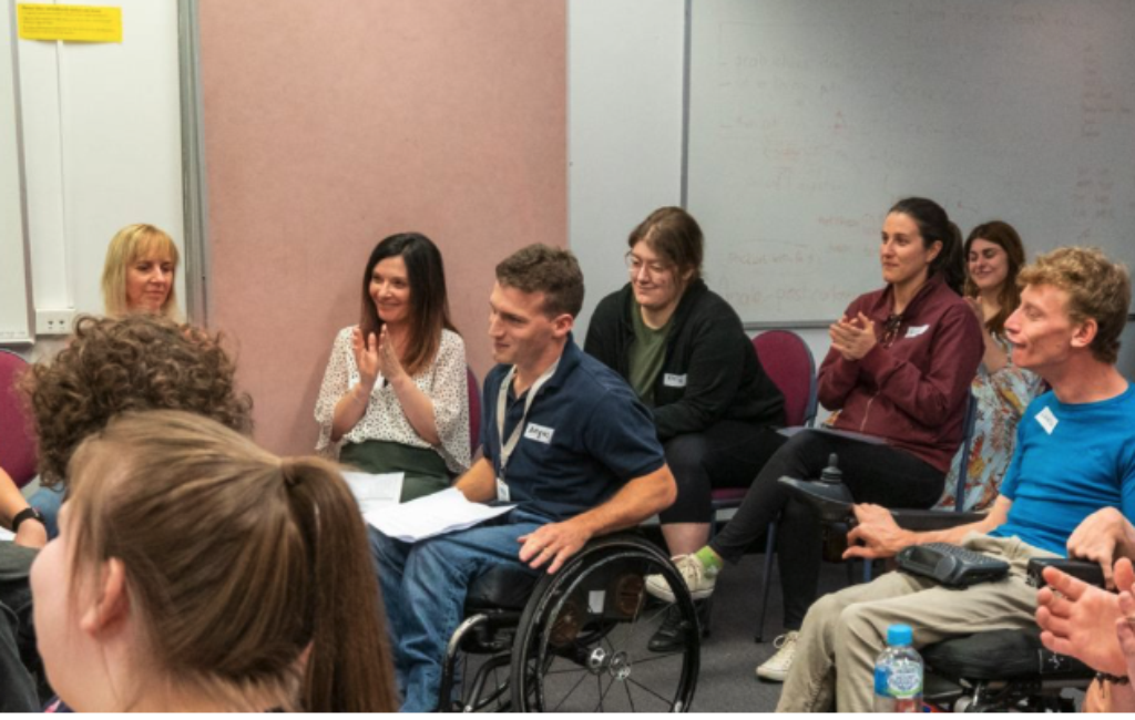 A group of 17 young people with disability at a peer group meeting