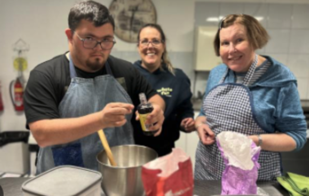 3 people baking in a kitchen for a Leisure Networks activity