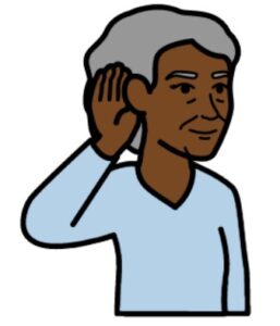 Woman in a blue shirt with her hand held up to her ear listening