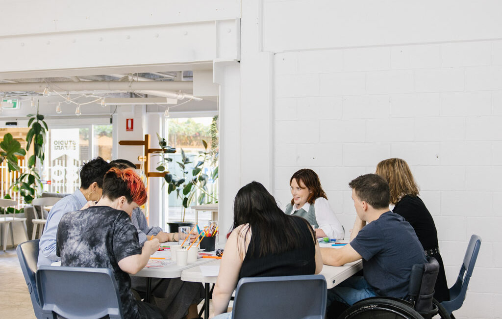 People sitting around a table doing an activity